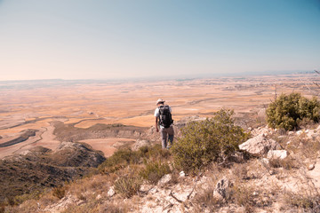 backpacker traveler with hat and white shirt
