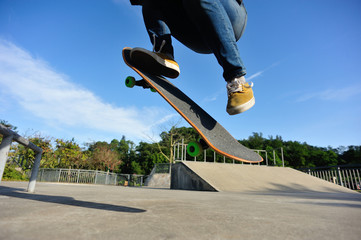 Skateboarder skateboarding on skate park