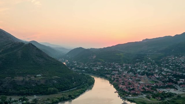 Amazing timelapse of sun setting over mountains behind the old Georgian town Mtskheta.