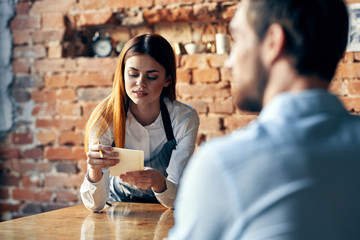 young woman drinking coffee in cafe