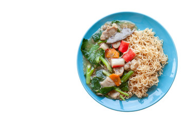 Fried noodle with pork, chinese kale and carrot thai call Rad Na in blue plate isolated on white background.