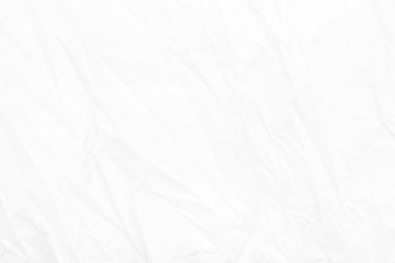Crumpled, Wrinkled of white paper fabric texture background with empty space for typing text.