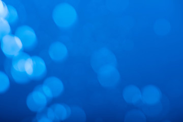 Abstract blue bokeh background.