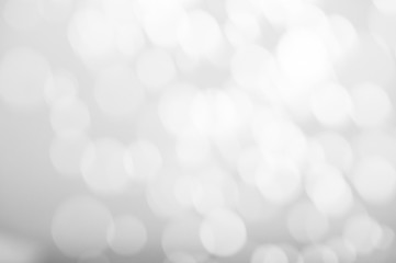 White bokeh abstract texture. Blurred bright light at night.