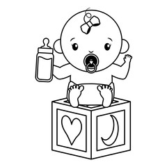 cute little baby girl with block toy and milk bottle