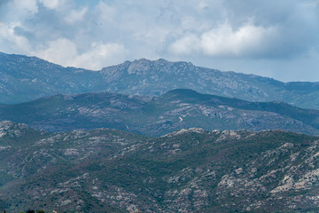 Fototapeta na wymiar Mountain backdrop to the town of Saint Florent, Corsica