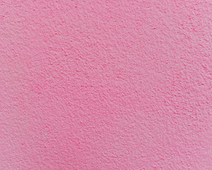 Pink cement or concrete wall texture for background. High resolution through process retouch.