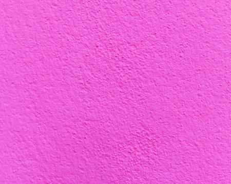 Pink cement or concrete wall texture for background. High resolution through process retouch.