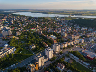 Aerial view of Slatina city and river Olt, Romania. Drone flight over the european city in summer day.