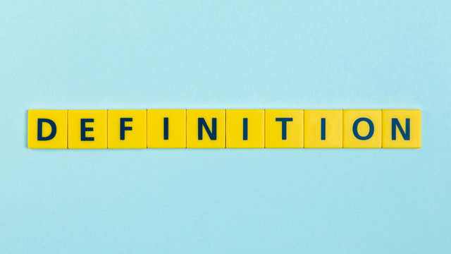 Definition word on scrabble tiles - Powered by Adobe