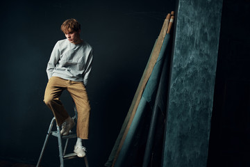 young man on ladder