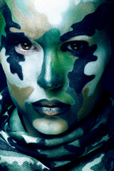 Beautiful young fashion woman with military style clothing and face paint make-up, khaki colors, halloween celebration