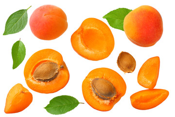 apricot fruits with slices and green leaf isolated on white background. top view