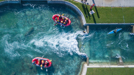Aerial Top view of 2 rafting boats fighting against Raging River
