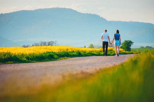 Couple walking in spring nature. Man and woman, people relationship concept photo