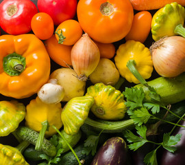 Summer vegetables of different colors. The alternation of colors in a rainbow. For salad or for a vegetable dish.