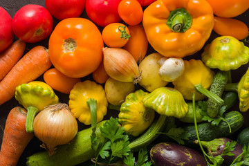Summer vegetables of different colors. The alternation of colors in a rainbow. For salad or for a vegetable dish.