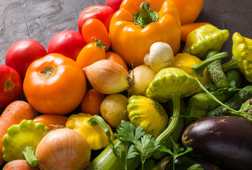 Summer vegetables of different colors. The alternation of colors in a rainbow. For salad or for a vegetable dish.