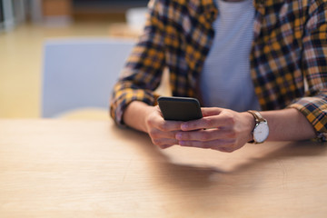 Male executive using mobile phone in office
