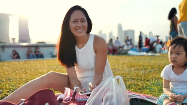 Asian Chinese Singapore enjoying picnic with family