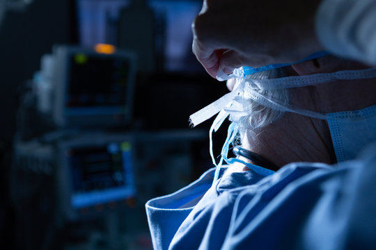 Surgeon wearing surgical mask in operating room of hospital