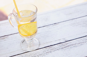 drink with lemon on wooden background. View from above