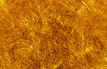  The texture of the plaster on the wall is painted in a languid yellow color. Background.