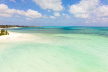 Warm lagoon with turquoise water. Lagoon near the tropical island. Seascape.