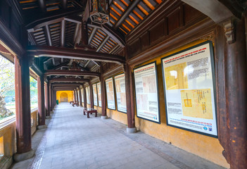 Amazing wooden hallway in the imperial Forbidden Citadel. The place that leads to the palaces of kings, feudal officials in the 19th century in Hue, Vietnam