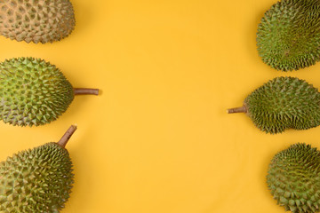 durian  on bright yellow background with copyspace