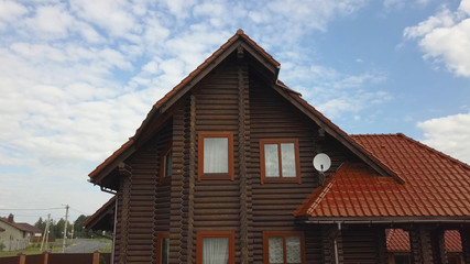 Beautiful wooden European house from a bar in the village.