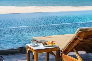 Breakfast at swimming pool in the resort