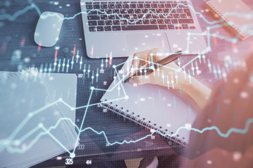 Forex chart displayed on woman's hand taking notes background. Concept of research. Multi exposure