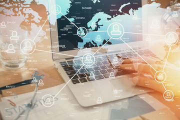 Social network theme hologram with businessman working on computer on background. Concept of world wide web. Double exposure.