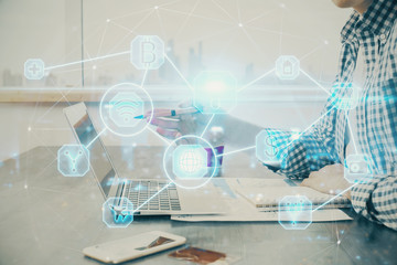 Social network theme hologram with businessman working on computer on background. Concept of world wide web. Double exposure.