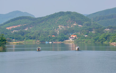 Cruise lonely boat at Perfume river. This is eco-tourism means peaceful waterways in the imperial city in Hue, Vietnam
