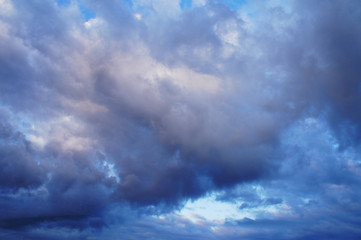 Naklejka na ściany i meble White and blue contrasting blue clouds in the sky.