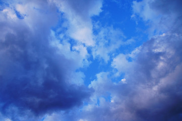 White and blue contrasting blue clouds in the sky.