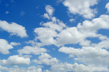 white clouds in the blue summer sky
