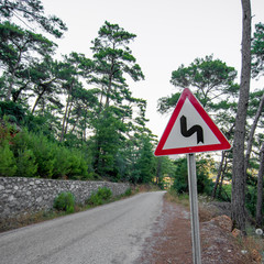 Road in summer tropical pine forest mountain peaks. Outdoors travel hiking, biking or autotripping