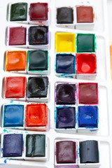 Colourful Watercolour Pallet of Messy Used Half Pan Paints