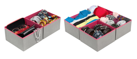 Box with folded things in the interior of the apartment