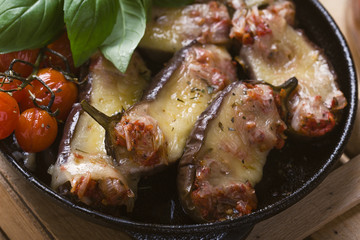 Baked eggplant stuffed with mozzarella cheese and tomatoes