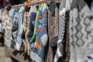 Knitted socks and slippers, Georgia. Street market with knitted socks and slippers,