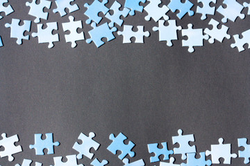 Puzzle pieces on a dark background.