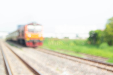 Fototapeta premium Railway machinery heads that have blurred the train tracks blur - industrial concepts with the head of the railway machinery blurred railway tracks. Background