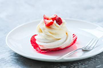 One beautiful pavlova dessert in a plate.
