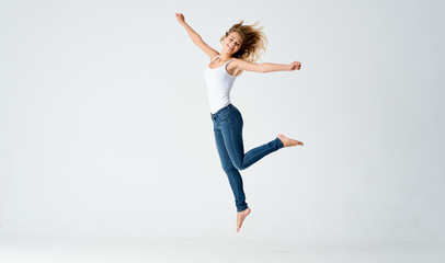 Fototapeta premium young woman jumping in the air
