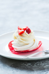 One beautiful pavlova dessert in a plate.
