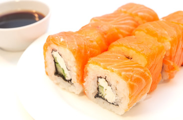 Rolls with salmon soy sauce on a plate